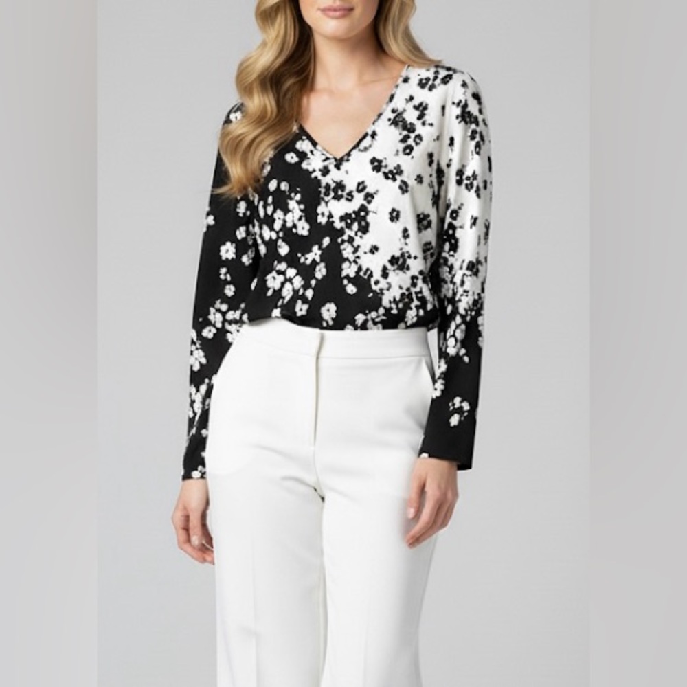 White House Black Market floral blouse .